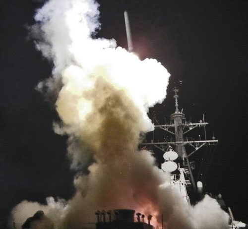 Arleigh Burke-class guided-missile destroyer USS Barry (DDG 52) launches a Tomahawk missile on March 19 in support of Operation Odyssey Dawn in the Mediterranean Seain. 