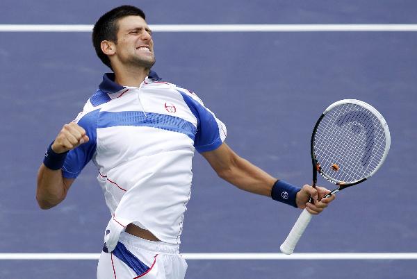 Novak Djokovic of Serbia celebrates defeating Rafael Nadal of Spain to win the men's final of the Indian Wells ATP tennis tournament in Indian Wells, California March 20, 2011. (Photo: Xinhua/Reuters) 