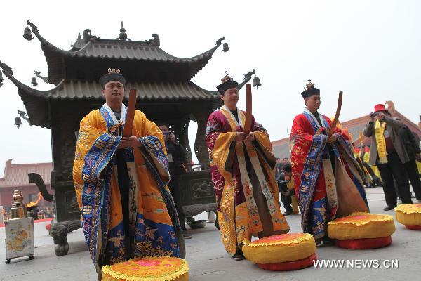 Taoist priests attend a memorial ceremony for Laozi (or Lao-tzu, Lao-tse 604-531 BC) 2,582 birth anniversary in Tianjing Palace (or Heavenly Peace Palace), Woyang County of east China's Anhui Province, March 19, 2011. 