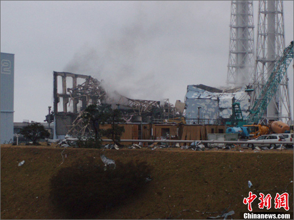 Smoke was spotted again Tuesday morning at two reactors at the troubled nuclear power plant in northeast Japan's Fukushima Prefecture.