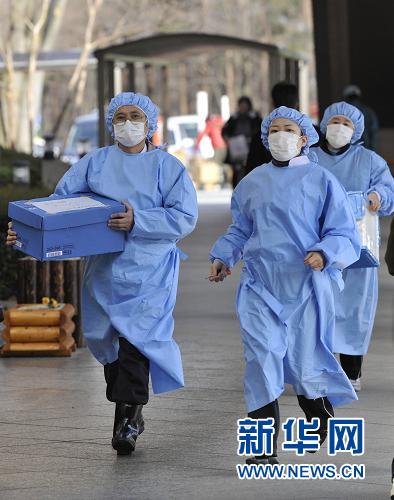 Nuclear radiation detection workers work at the scene in Fukushima Prefecture, Japan, on March 19, 2011. The Japanese government on Monday issued an order to four prefectures near the quake-stricken Fukushima Daiichi nuclear power plant to halt shipments of certain food items due to the detection of abnormally high levels of radiation. 