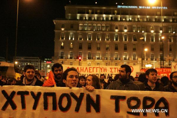 Demonstrators protest against NATO's military operation in Libya in the center of Athens, capital of Greece, March 22, 2011. The demonstration was organized by labor unions and Left-wing parties. [Marios Lolos/Xinhua]