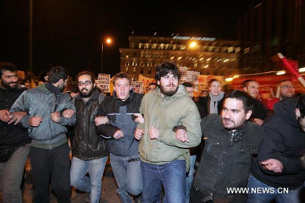 Demonstrators protest against NATO's military operation in Libya in the center of Athens, capital of Greece, March 22, 2011. The demonstration was organized by labor unions and Left-wing parties. [Marios Lolos/Xinhua]