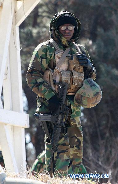 A soldier participates in the Combined Joint Logistics Over-The-Shore Operations (CJLOTS) during the joint military exercise Foal Eagle 2011 between South Korea and the United States at Anmyeondo beach in Chungcheong province of South Korea on March 23, 2011. South Korea and the United States started the month-long joint military exercise, &apos;Foal Eagle&apos;, on Feb. 28. [Park Jin Hee/Xinhua]