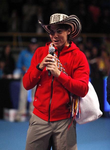 Rafael Nadal of Spain speaks to the public wearing a typical Colombian 'Vueltiao' hat after winning an exhibition tennis match against Novak Djokovic of Serbia in Bogota March 21, 2011.(Xinhua/Reuters Photo)