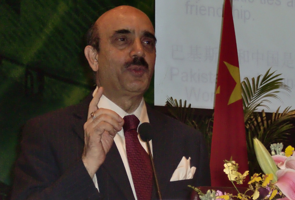 Pakistan's ambassador to China, Masood Khan, addresses the guests gathering for a dinner reception and investiture ceremony at the Grand Millennium Hotel to celebrate Pakistan's 71st National Day on March 23, 2010.