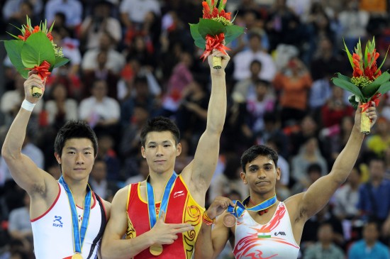 A Chinese judge facing disciplinary action over illegal score changing at last fall's Asian Games in Guangzhou insists he acted correctly to produce a fair result. Pictured: Korea's Kim Soo Myun and China's Zhang Chenglong share the gold medal for floor exercise in Guangzhou.