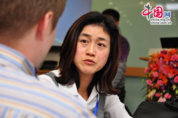 Shirley Wong Walker, Healthcare Practice Director for communications agency Waggener Erdstrom Worldwide, talks to China.org.cn reporter Corey Cooper at the TB Forum hosted by the Global Business Council on HIV/AIDS, Tuberculosis and Malaria in Beijing on March 22, 2011.
