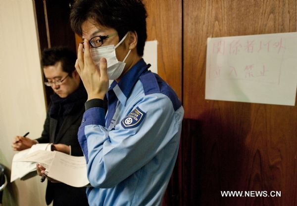 A staff member of Tokyo Electric Power Co. (TEPCO) listens during a press conference held at the disaster countermeasures unit in Fukushima City, Japan, March 25, 2011. The city has been witnessing a change of people&apos;s life since the nuclear crisis broke out at the the crippled Fukushima Daiichi nuclear power plant after the earthquake.[Huang Xiaoyong/Xinhua]