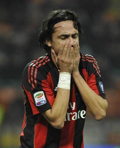 AC Milan's Filippo Inzaghi reacts after an accident during the Italian Serie A soccer match against Palermo at San Siro stadium in Milan November 10, 2010.  (Xinhua/Reuters)