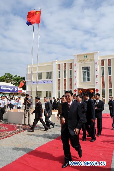 Cambodian Deputy Prime Minister Sok An (front), who is also minister of the Council of Ministers, attends the inauguration ceremony of a new teaching building of the Confucius Institute of the Royal Academy of Cambodia, in Phnom Penh, Cambodia, March 28, 2011. 