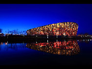 The National Stadium, as the main track and field stadium for the 2008 Olympics Games, is dubbed the 'bird's nest' because of its innovative grid formation.The stadium was begun in March 2004 and finished in March 2008. It was built with 36 kilometers of unwrapped steel, with a combined weight of 45,000 tonnes. Covering over 258,000 square meters, the stadium has at least 100,000 seats. [manqingwangye/jingnei.net] 
