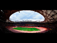 The National Stadium, as the main track and field stadium for the 2008 Olympics Games, is dubbed the 'bird's nest' because of its innovative grid formation.The stadium was begun in March 2004 and finished in March 2008. It was built with 36 kilometers of unwrapped steel, with a combined weight of 45,000 tonnes. Covering over 258,000 square meters, the stadium has at least 100,000 seats. [远山摄影/jingnei.net ]