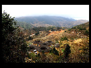 Photo shows the Tianluokeng Tulou, earth buildings in Chinese, in Nanjing County, southeast China's Fujian Province. Built on a base of stone, the thick walls of Tulou were packed with dirt and fortified with wood or bamboo internally. The architectural arts of the Fujian Tulou can be traced back nearly 1,000 years, and their design incorporates the tradition of fengshui (favorable siting within the environment). [老人河  /forums.nphoto.net]