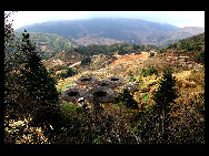 Photo shows the Tianluokeng Tulou, earth buildings in Chinese, in Nanjing County, southeast China's Fujian Province. Built on a base of stone, the thick walls of Tulou were packed with dirt and fortified with wood or bamboo internally. The architectural arts of the Fujian Tulou can be traced back nearly 1,000 years, and their design incorporates the tradition of fengshui (favorable siting within the environment). [老人河  /forums.nphoto.net]