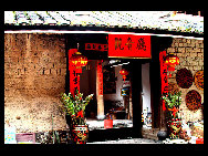 Photo shows the Tianluokeng Tulou, earth buildings in Chinese, in Nanjing County, southeast China's Fujian Province. Built on a base of stone, the thick walls of Tulou were packed with dirt and fortified with wood or bamboo internally. The architectural arts of the Fujian Tulou can be traced back nearly 1,000 years, and their design incorporates the tradition of fengshui (favorable siting within the environment). [老人河  /forums.nphoto.net]