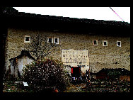 Photo shows the Tianluokeng Tulou, earth buildings in Chinese, in Nanjing County, southeast China's Fujian Province. Built on a base of stone, the thick walls of Tulou were packed with dirt and fortified with wood or bamboo internally. The architectural arts of the Fujian Tulou can be traced back nearly 1,000 years, and their design incorporates the tradition of fengshui (favorable siting within the environment). [老人河  /forums.nphoto.net]