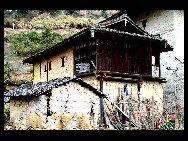 Photo shows the Tianluokeng Tulou, earth buildings in Chinese, in Nanjing County, southeast China's Fujian Province. Built on a base of stone, the thick walls of Tulou were packed with dirt and fortified with wood or bamboo internally. The architectural arts of the Fujian Tulou can be traced back nearly 1,000 years, and their design incorporates the tradition of fengshui (favorable siting within the environment). [老人河  /forums.nphoto.net]