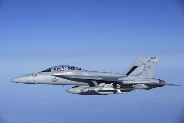 A U.S. Navy EA-18G Growler electronic warfare jet from the Electronic Attack Squadron &apos;Scorpions&apos; is refueled by a Canadian Forces Airbus CC-150 Polaris tanker over the Mediterranean Sea near Trapani, Italy, in this Canadian Forces handout photo dated March 29, 2011. The Growler is helping to enforce the no-fly zone over Libya. Picture is taken March 29, 2011. [Xinhua]