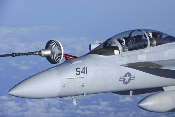 A U.S. Navy EA-18G Growler electronic warfare jet from the Electronic Attack Squadron &apos;Scorpions&apos; flies over the Mediterranean Sea near Trapani, Italy, in this Canadian Forces handout photo dated March 29, 2011. The Growler is helping to enforce the no-fly zone over Libya. Picture is taken March 29, 2011. [Xinhua]