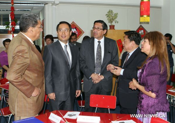 Chinese Ambassador to Chile Lu Fan (2nd L, front) attends the opening of the Confucius Classroom at Santiago National College in Chile, April 4, 2011. The Santiago National College saw on Tuesday the launching of Chile's first Confucius Classroom, a non-profit program aiming at teaching Chinese language and culture. [Ye Shuhong/Xinhua]