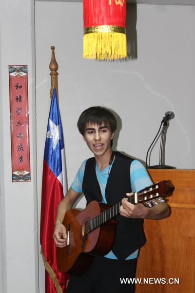 A student performs a Chinese song at the opening of the Confucius Classroom at Santiago National College in Chile, April 4, 2011. The Santiago National College saw on Tuesday the launching of Chile's first Confucius Classroom, a non-profit program aiming at teaching Chinese language and culture. [Ye Shuhong/Xinhua]