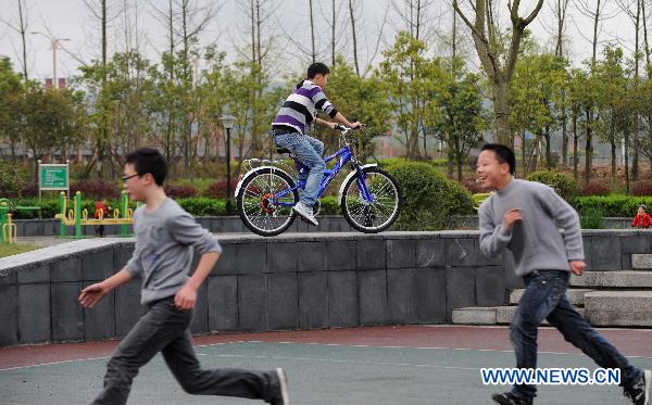 Teenagers frolic in the new county seat of quake-jolted Beichuan, southwest China's Sichuan Province, April 5, 2011. 