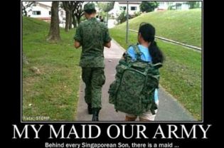 A Singaporean soldier was pictured with a maid carrying his backpack.