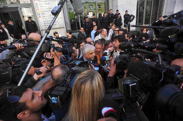 The lawyer of Italian Prime Minister Silvio Berlusconi, Giorgio Perroni (C), speaks to the press in front of Milan justice court during the first hearing of the 'Ruby the Heart Stealer' case's trial on April 6, 2011. Italian Prime Minister Silvio Berlusconi's trial on charges of sex with an underage prostitute, Karima El Mahroug, nicknamed 'Ruby the Heart Stealer', and abuse of power, opened and was immediately postponded by judges to May 31. 