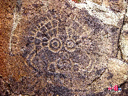 Located 56 kilometers from Yinchuan city, the rock paintings in Helan Mountain are the works done by different ethnic groups of different times covering the themes of nomadic life, sacrifice to gods, animals and human images as well as knives, axes, stone chains, traps and carts. It was listed on the unofficial world cultural heritages by the UNESCO International Committee of Rock Painting in 1977. [Photo: China.org.cn] 