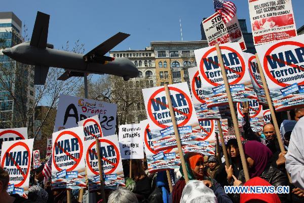 Anti-war demonstrators participate in a rally on Union Square in New York, the United States, April 9, 2011. 