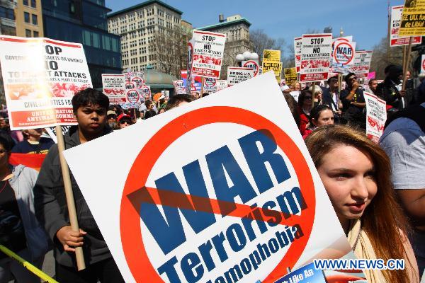 Anti-war demonstrators participate in a rally on Union Square in New York, the United States, April 9, 2011. 