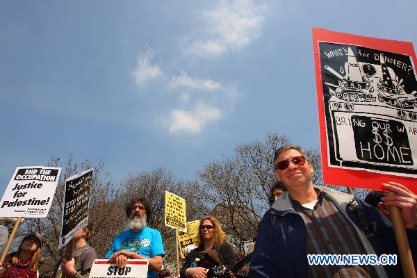 Anti-war demonstrators participate in a rally on Union Square in New York, the United States, April 9, 2011. 