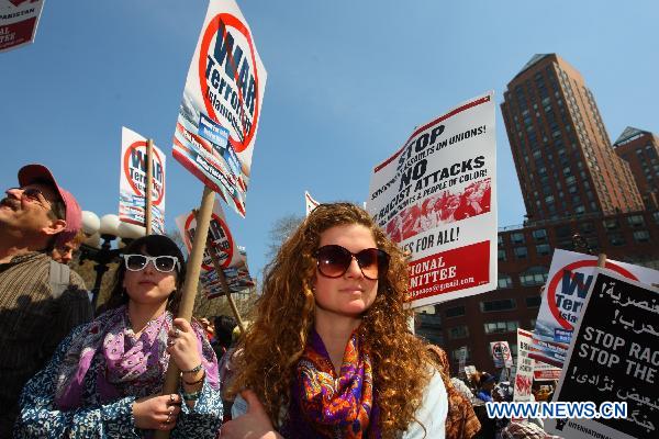 Anti-war demonstrators participate in a rally on Union Square in New York, the United States, April 9, 2011. 