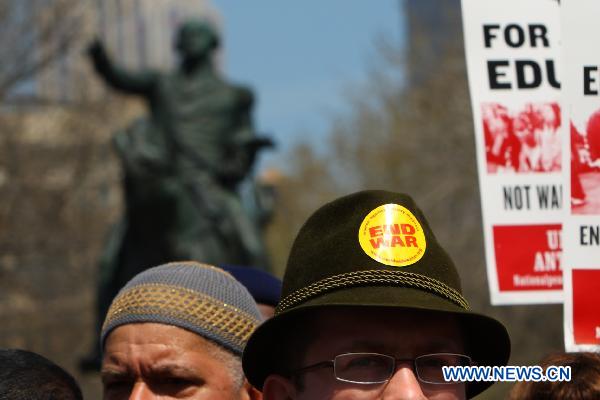 Anti-war demonstrators participate in a rally on Union Square in New York, the United States, April 9, 2011.