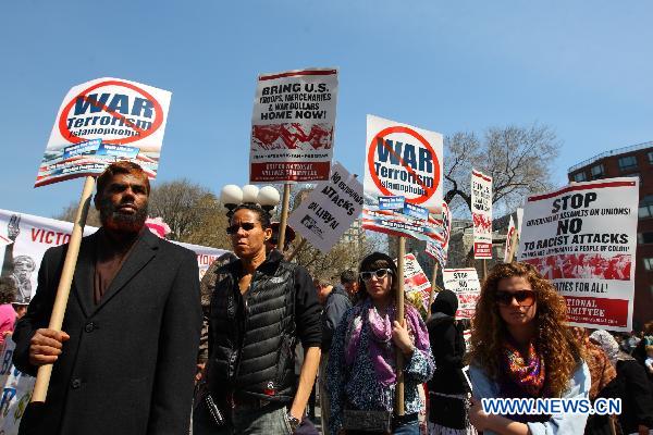 Anti-war demonstrators participate in a rally on Union Square in New York, the United States, April 9, 2011. 