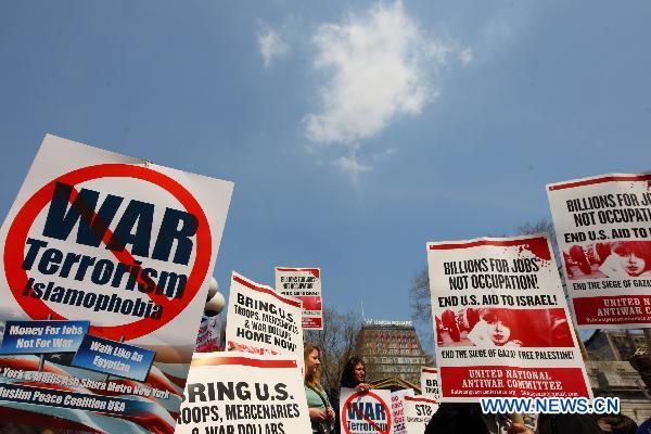 Anti-war demonstrators participate in a rally on Union Square in New York, the United States, April 9, 2011. 