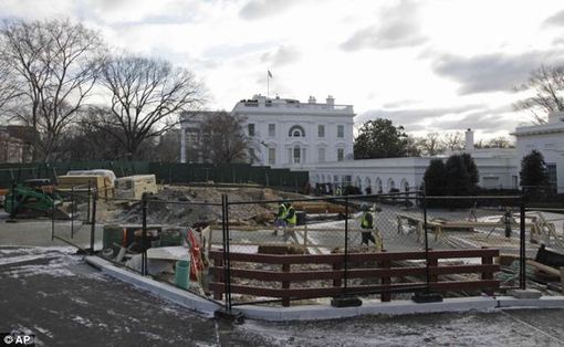 Work goes on near the West Wing of the White House. The four-year project will cost $86 million and the front yard at 1600 Pennsylvania will remain a noisy building site.