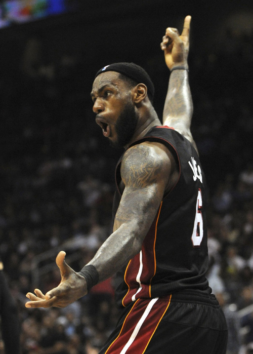 Miami Heat forward LeBron James reacts to a call in the second half of their NBA basketball game against the Atlanta Hawks in Atlanta, Georgia April 11, 2011. (Xinhua/Reuters Photo)