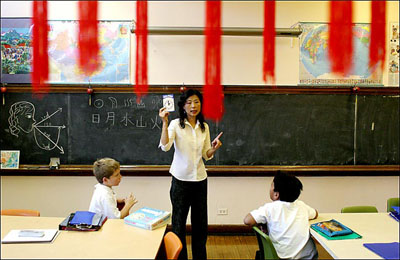 In this file photo, a teacher from China teaches Chinese language in a school in Chicago. Chicago Mayor Richard Daley and Chicago Public Schools officials announced 480,217 U.S. dollars in grants that will be used to support the school system's Chinese language and culture programs on April 12, 2011. 