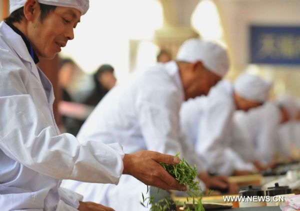 A tea fair kicked off in Xinchang on Monday, with the participation of tea experts, scholars and noted tea enterprises across the country. Xinchang County, which is well known for its production of Longjing Tea (Dragon Well Tea), created 540 million yuan (82.6 million U.S. dollars) of production value with its 120,000 mu (8,000 hectares) of tea planting area in 2010. Some 18 percent of local farmers' net income comes from the tea industry. (