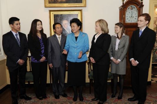 Chinese State Councilor Liu Yandong (4th L) and U.S. Secretary of State Hillary Clinton (3rd R) talk with participants during the second round of high-level consultation meeting on people-to-people and cultural exchanges between the two countries, in Washington D.C., capital of the United States, April 12, 2011. [Zhang Jun/Xinhua]