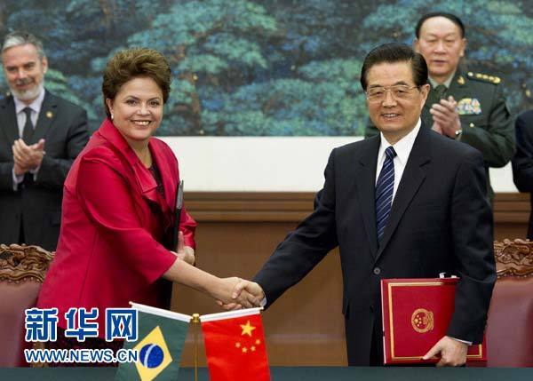 President Hu Jintao shakes hands with Brazilian President Dilma Rousseff during a signing ceremony at the Great Hall of the People in Beijing on April 12, 2011.
