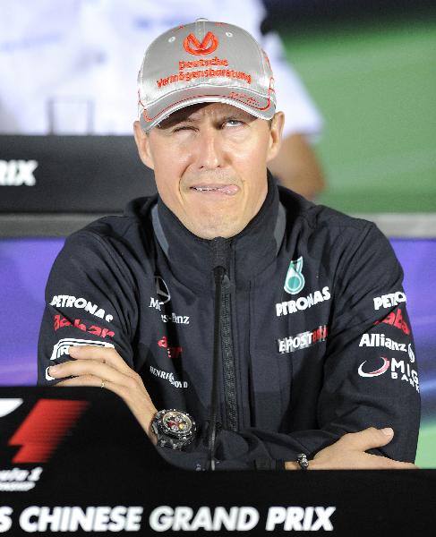 Michael Schumacher of Germany and Mercedes GP gets confused by a question as he attends the drivers press conference during previews to the Chinese Formula One Grand Prix at the Shanghai International Circuit on April 14, 2011 in Shanghai, China. (Xinhua/AFP Photo) 