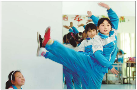 Students of Gushan Middle School in Weihai, Shandong province, practice dancing on March 30.