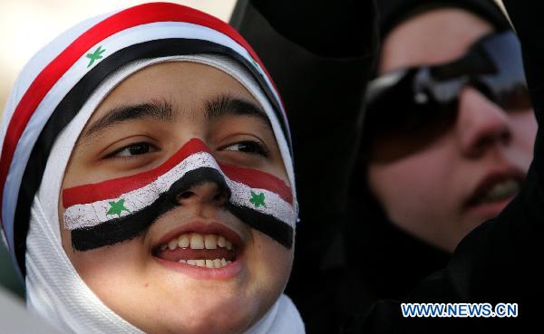 A Syrian girl shouts slogans during a sit-in attended by scores of Syrians living in Jordan against Bashar's government and the ruling Baath Party in front of Syrian embassy in Amman, capital of Jordan, on April 17, 2011.[Mohammad Abu Ghosh/Xinhua]