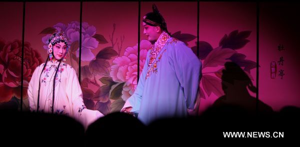 An actress and an actor from China's Shanghai Kunju Opera Company perform the Kunqu opera 'The Peony Pavilion' during the Shanghai Culture Month in Paris, capital of France, April 18, 2011. 'The Peony Pavilion' is a love story about Du Liniang, daughter of a wealthy official, and Liu Mengmei, a talented but poor young scholar. (Xinhua/Gao Jing) (wjd) 