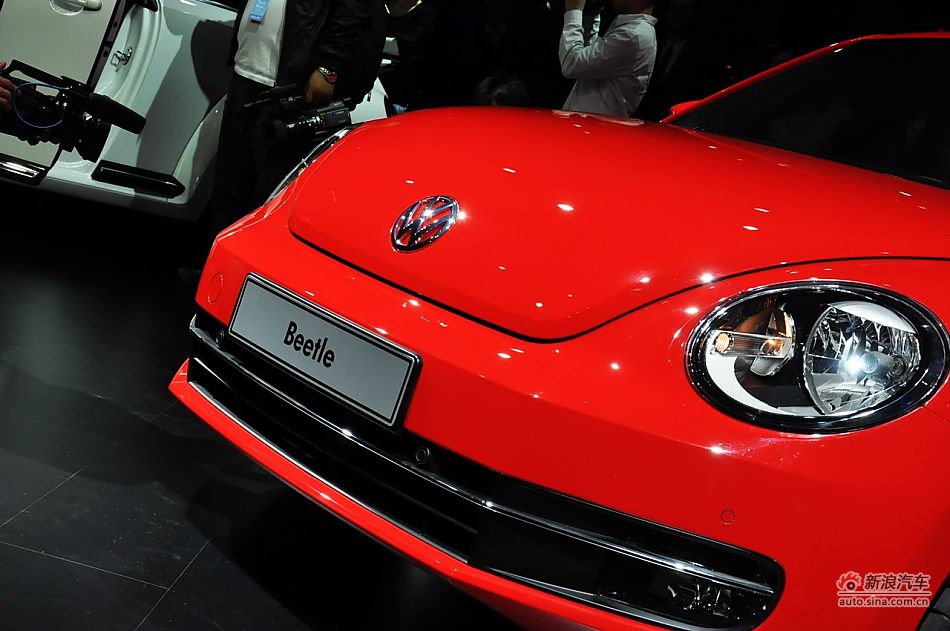 The New Beetle is unveiled at the 2011 Shanghai Auto Show. Started from April 20, 2011, more than 1,000 car models from about 20 countries are on display at the show and 75 of them are making their world premiere.