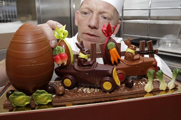 La Maison du Chocolat's creative director Gilles Marchal inspects a chocolate retro car creation in preparations for Easter at their workshop in Nanterre, near Paris April 20, 2011. Some 13,000 tonnes of chocolate are sold in France during the Easter holiday period, which counts for 3.5 percent of total yearly sales or even more for luxury chocolate stores. [Xinhua/Reuters] 