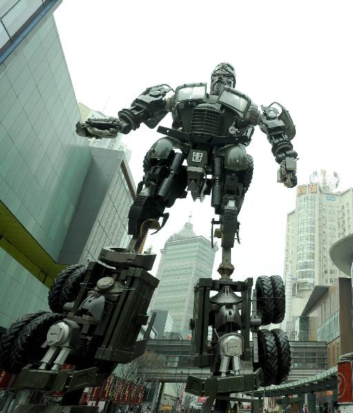 A transformer model featuring legendary Chinese general Guan Yu towers up on a street in downtown Shenyang, northeast China's Liaoning Province, April 20, 2011. 